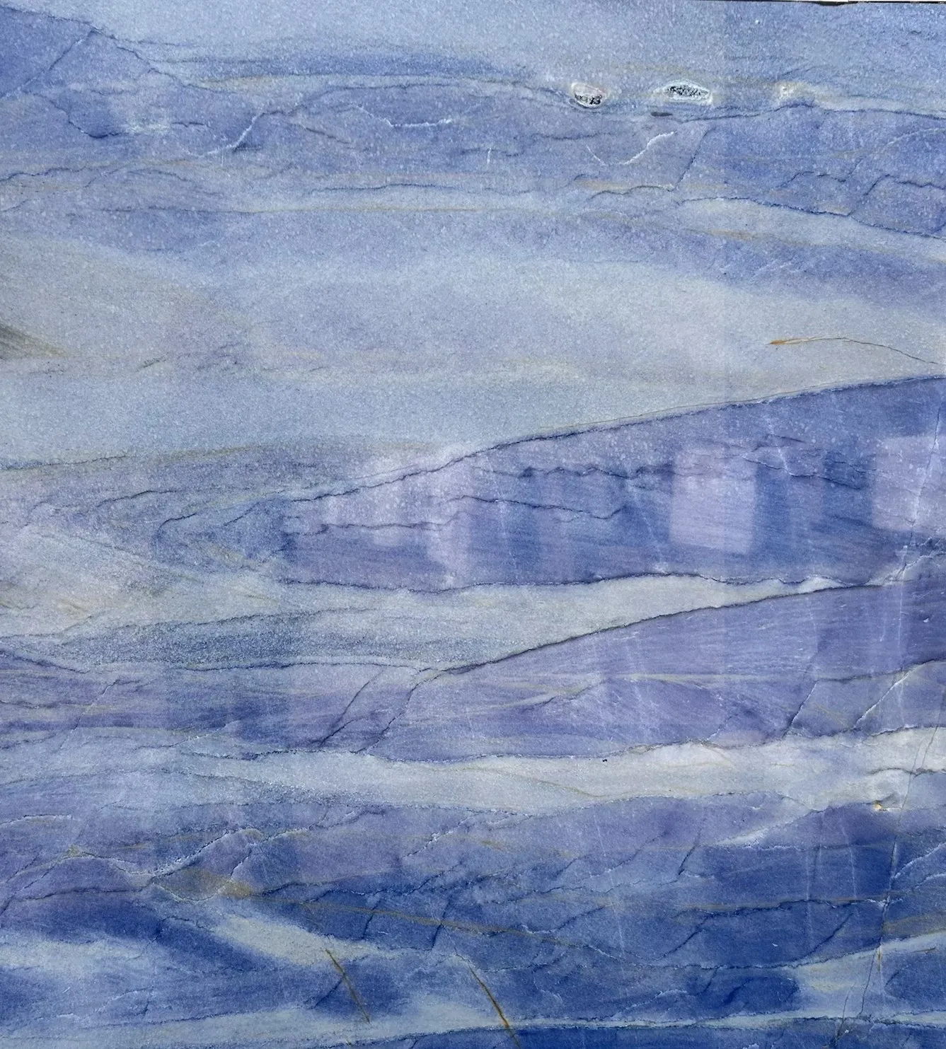 Blue and gray marbled stone texture.