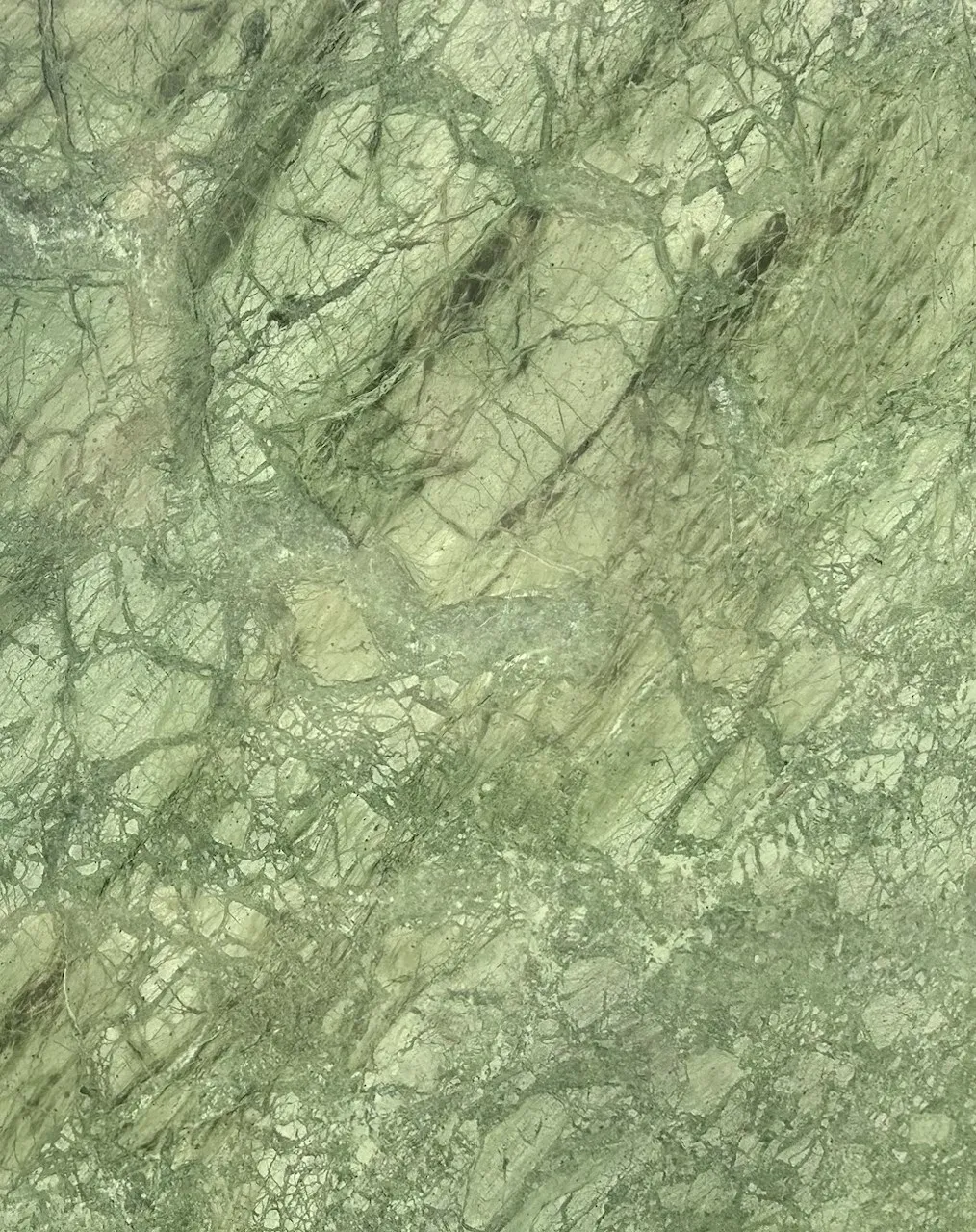 Green marble texture with intricate vein patterns.
