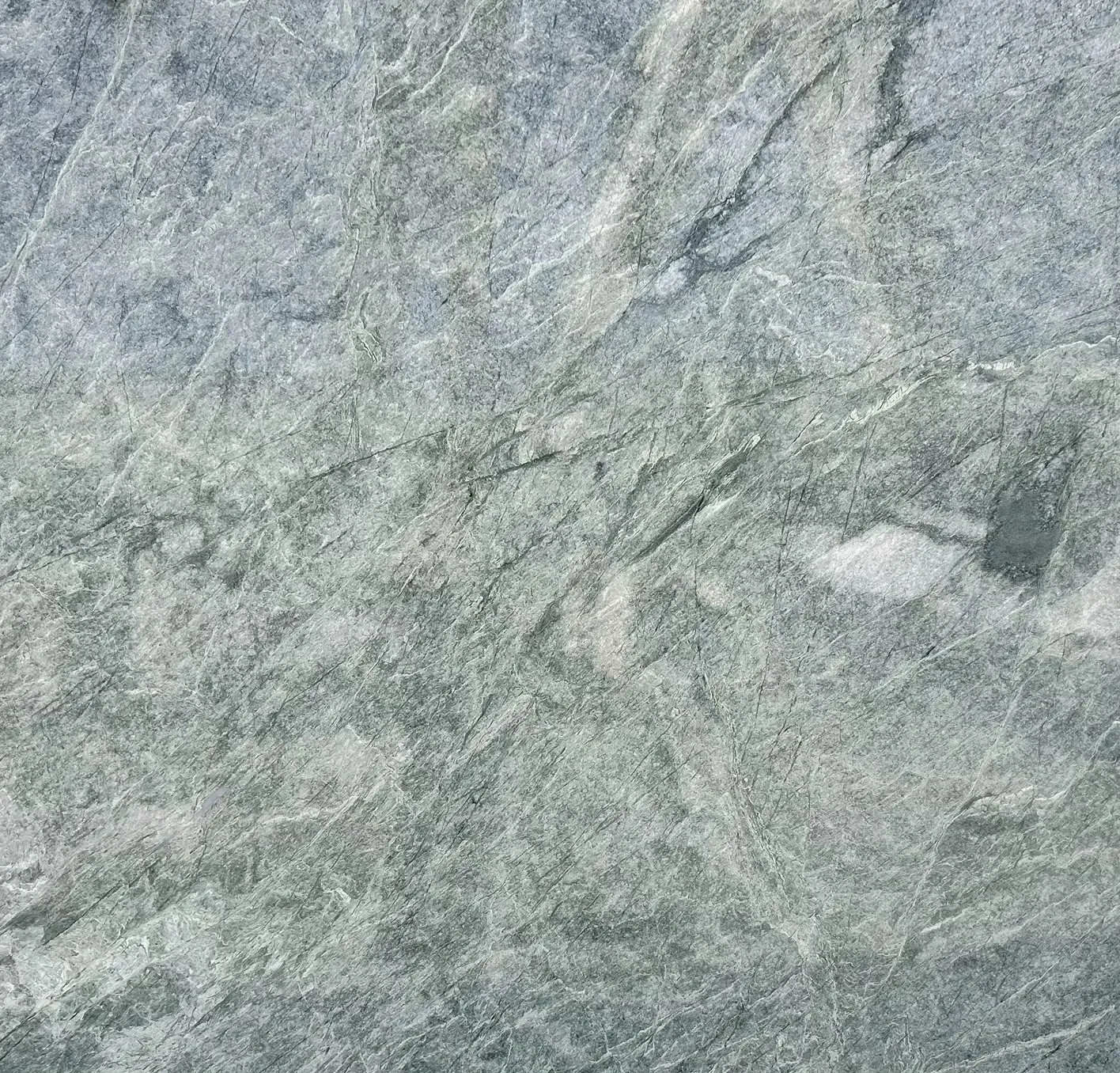 Textured grey stone surface with visible veins.